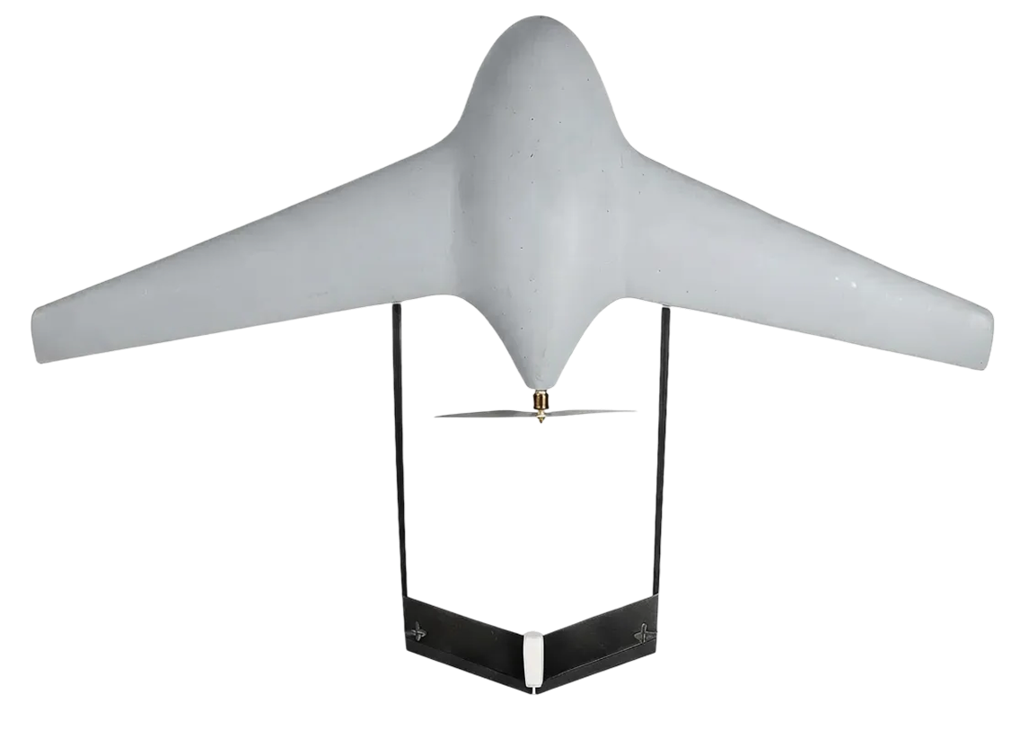 Front view of a small gray drone with a wide wing span and a propeller underneath.