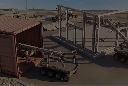 Robotic vehicles with mechanical arms unloading and assembling a metal structure near a shipping container on a flat surface under a clear sky.