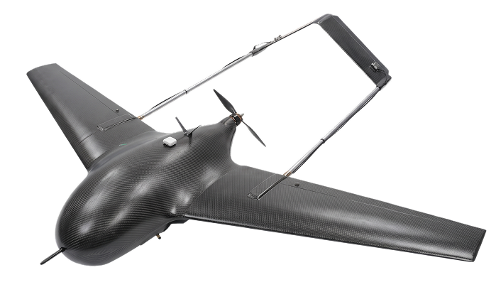 Black carbon fiber drone with wide wings and a rear-mounted propeller.