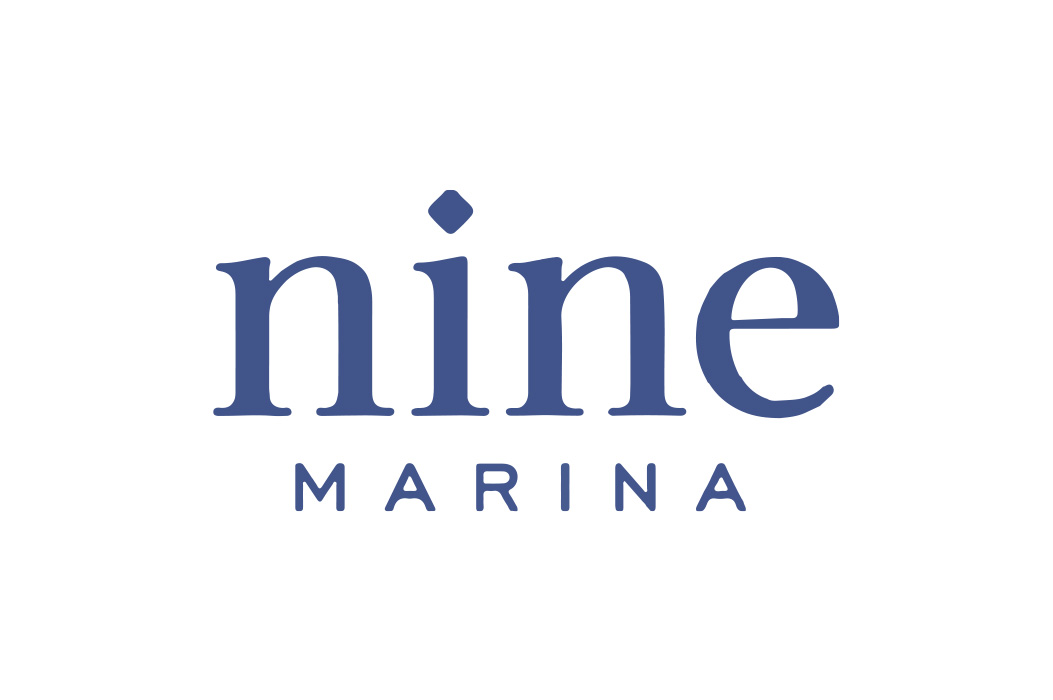 Logo with the word 'nine' in large serif font and 'MARINA' in smaller uppercase letters below.