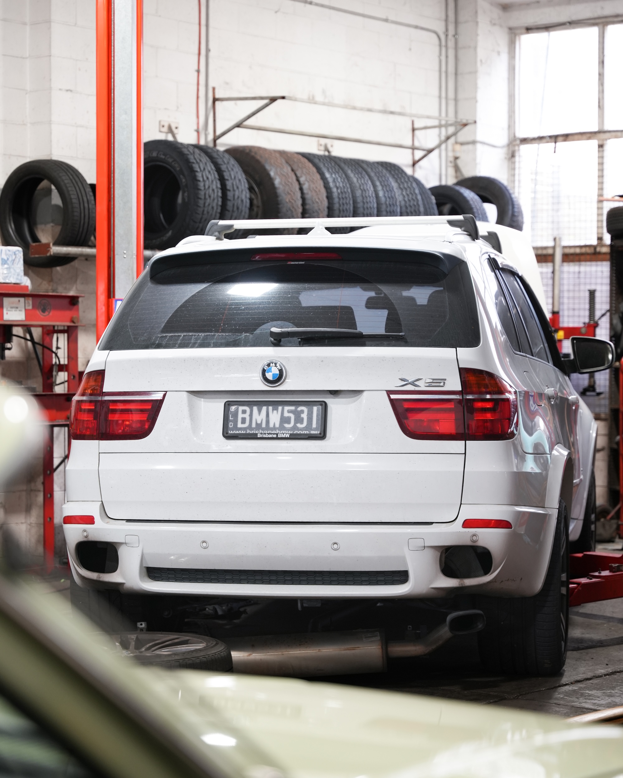 Technician performing a water pump replacement and internal engine cooling system overhaul to prevent overheating.