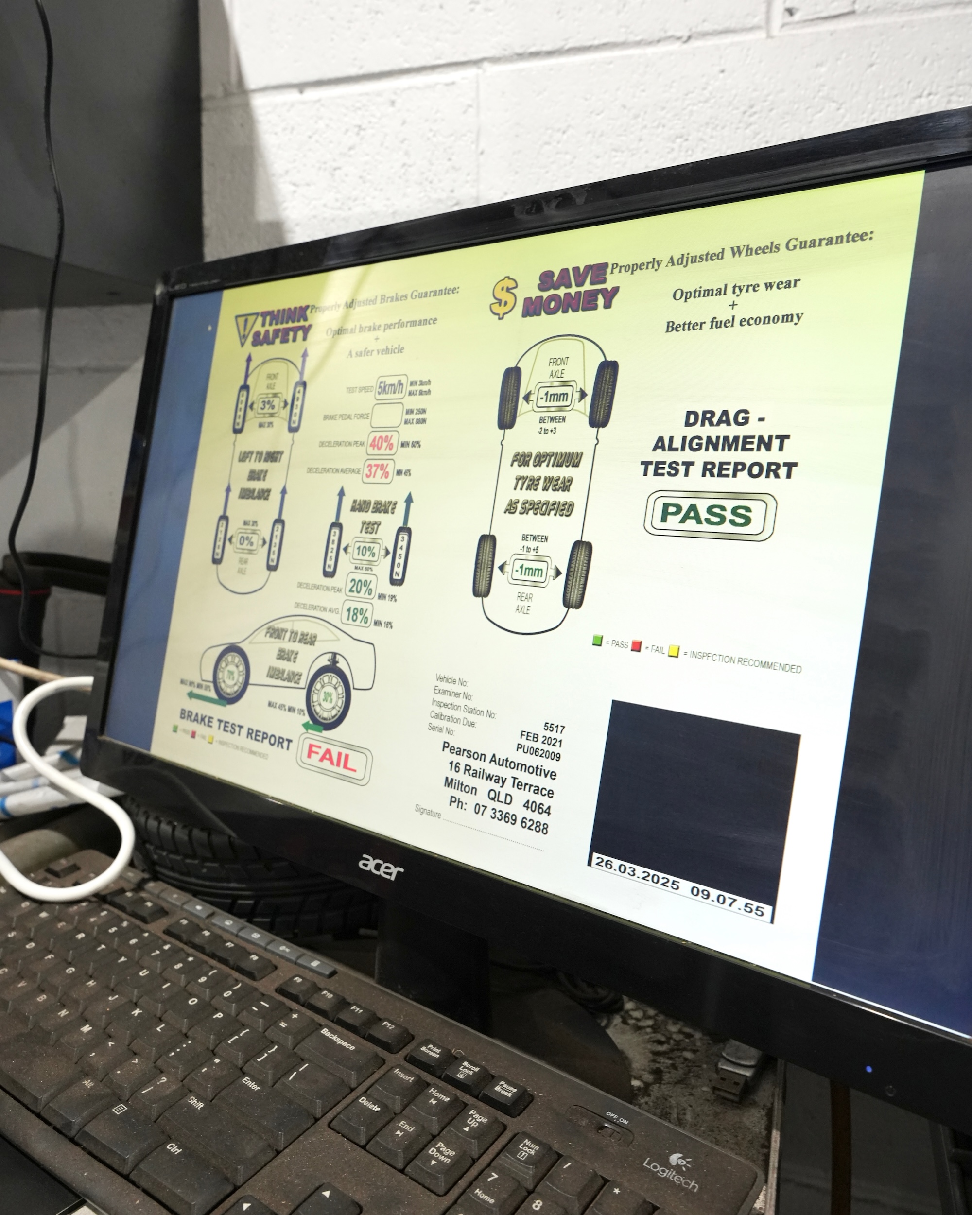 Computer monitor displaying detailed vehicle diagnostic test results and alignment safety report at Pearson Automotive Milton.