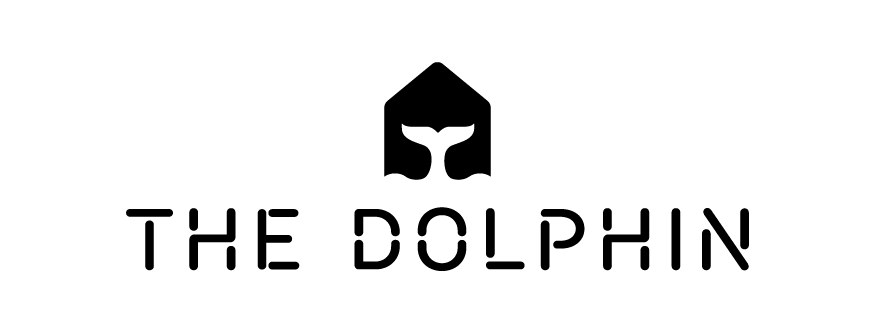 Logo featuring a stylized dolphin tail inside a house-shaped outline above the text 'THE DOLPHIN'.