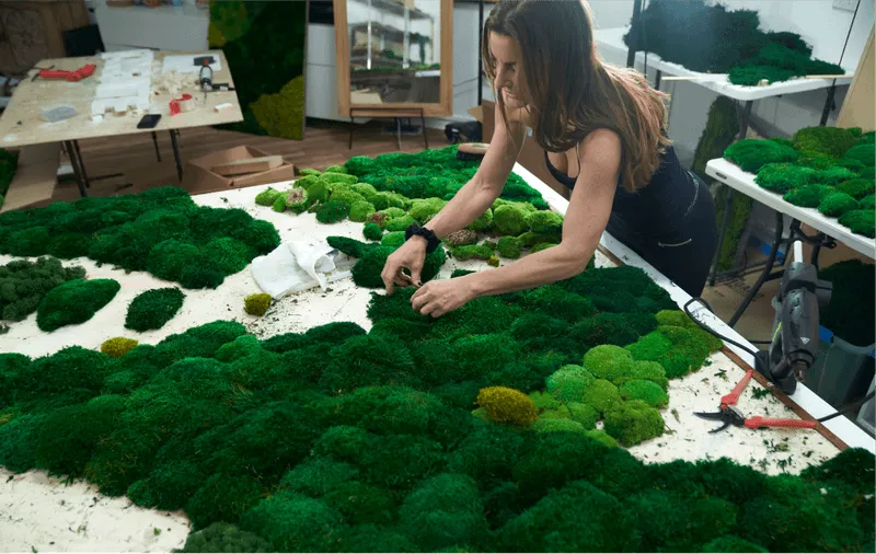 Mary creating a moss design