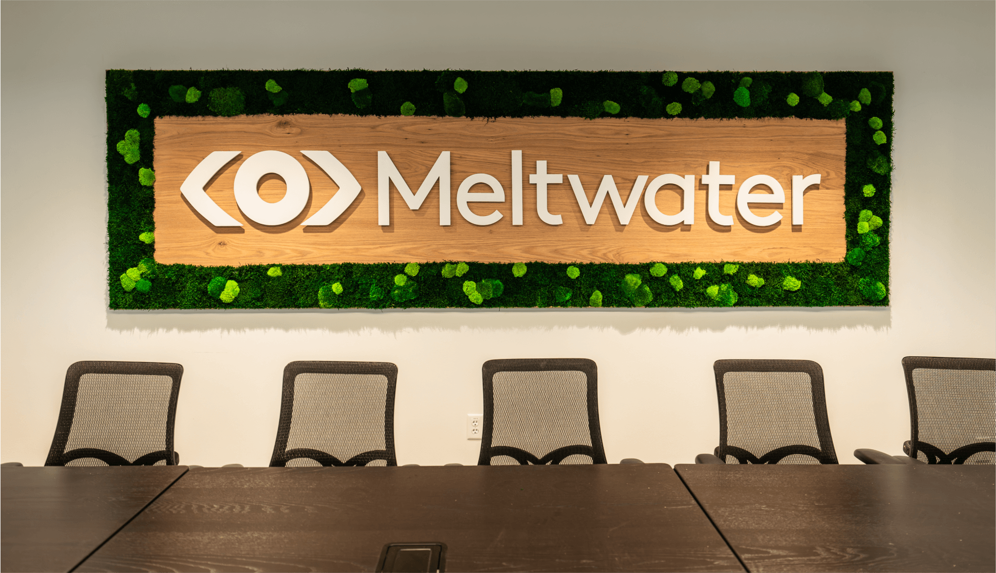Meltwater Austin conference room moss wall with dimensional logo