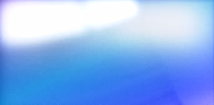 Abstract blurred gradient background with blue, purple, and white colors.