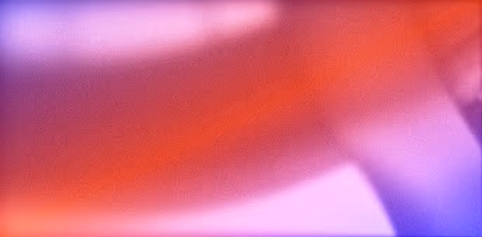 Abstract image with blurred streaks of red, purple, and pink colors.