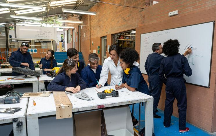 Students learning skilled trades in a career and technical education classroom with hands-on training and instructor guidance.