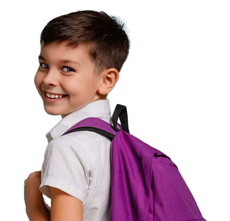 Smiling young boy wearing a white shirt and carrying a purple backpack over one shoulder.