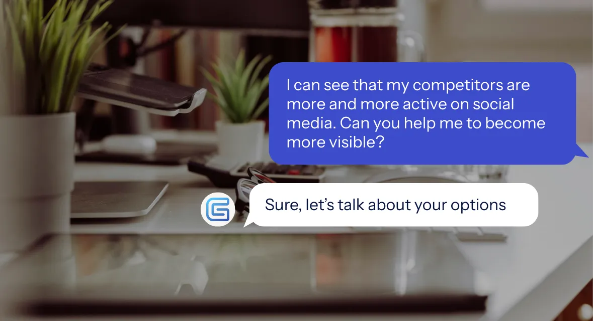 Modern office desk with keyboard, computer mouse, eyeglasses, two small potted plants, French press coffee, and a glass of water.