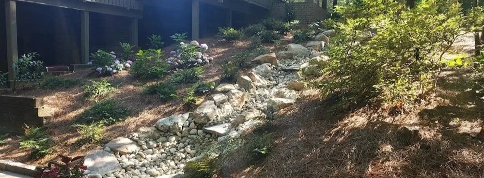 Dry creek bed storm drainage landscaping tip for yard flooding