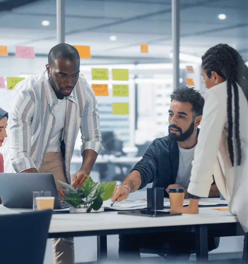 Team collaborating on AI-powered micro-learning strategy.