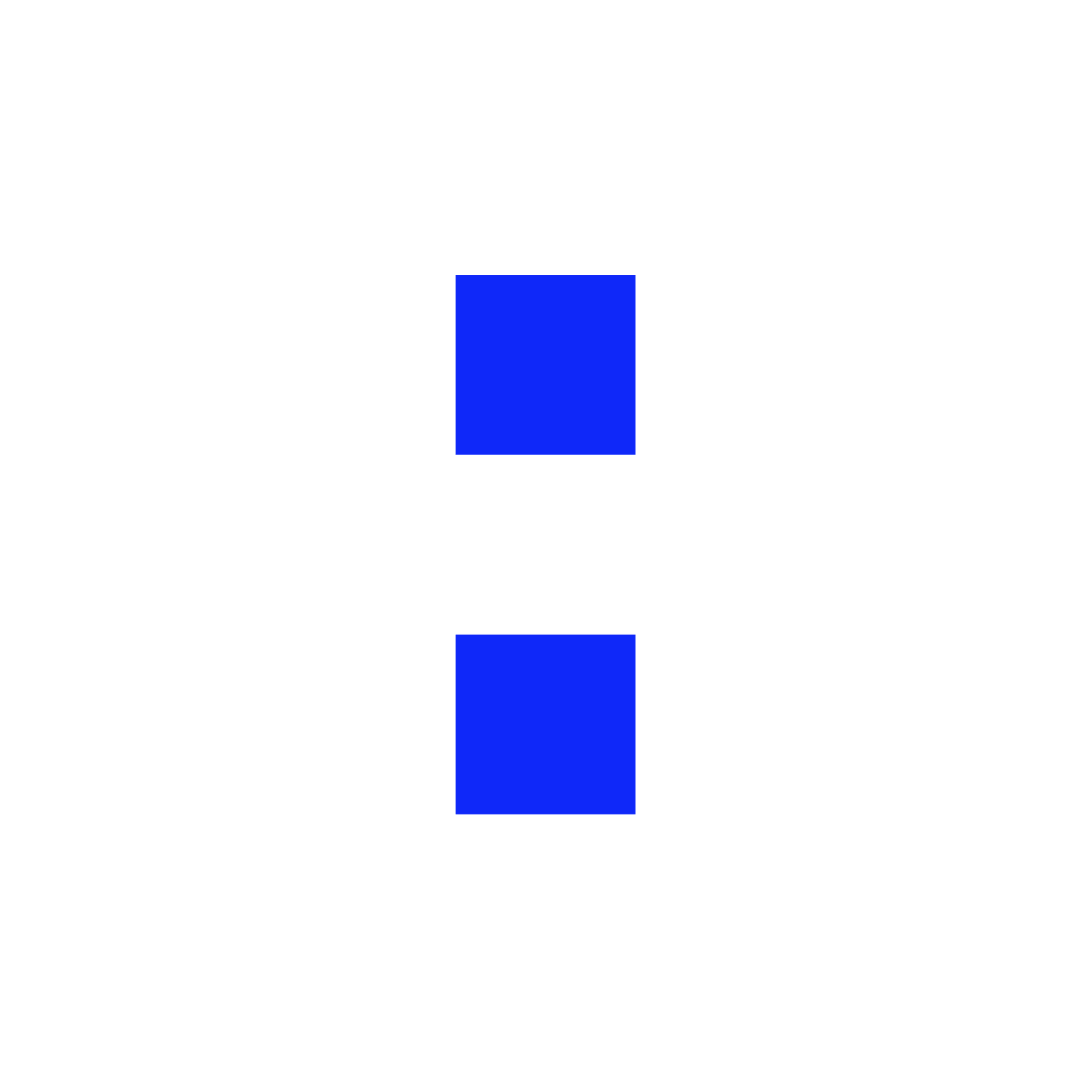 Man with glasses and beard speaking at a podium with a microphone in a lecture hall.