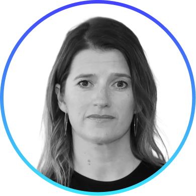 Black and white headshot of a woman with long hair wearing hoop earrings inside a blue circular frame.