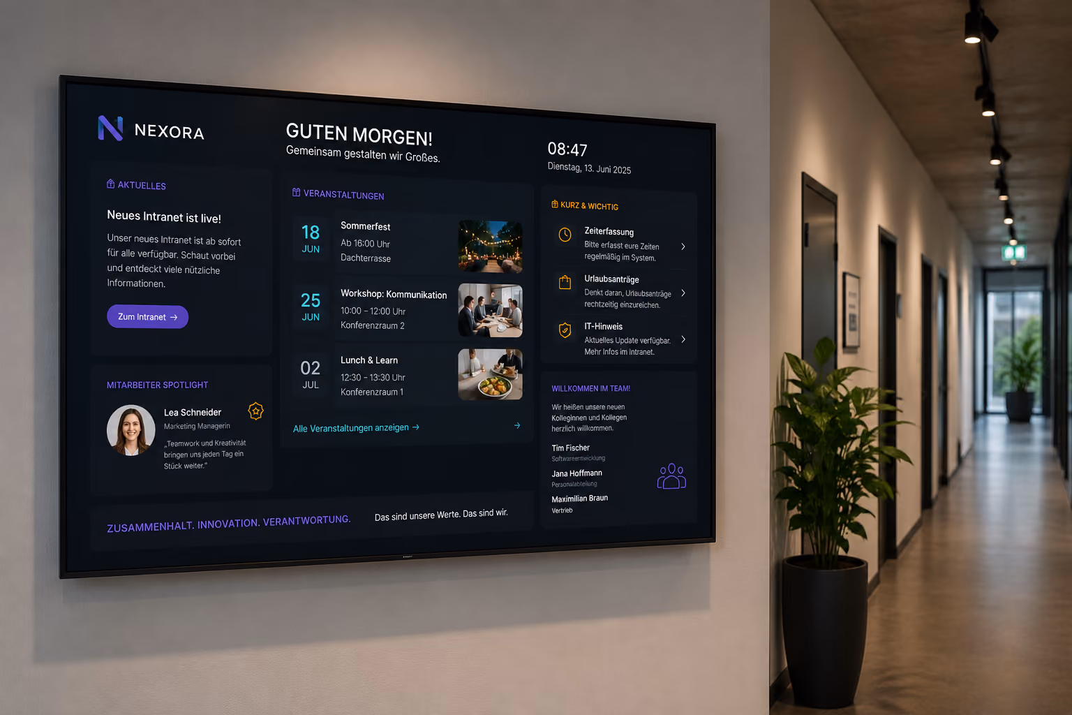 A digital notice board on a display shows internal news, shift schedules, and company information for employees.