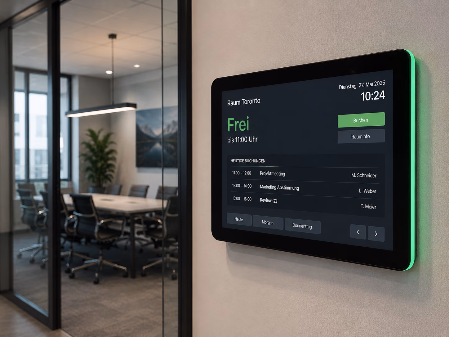 Digital room booking display in front of a meeting room shows occupancy, time, and room status.