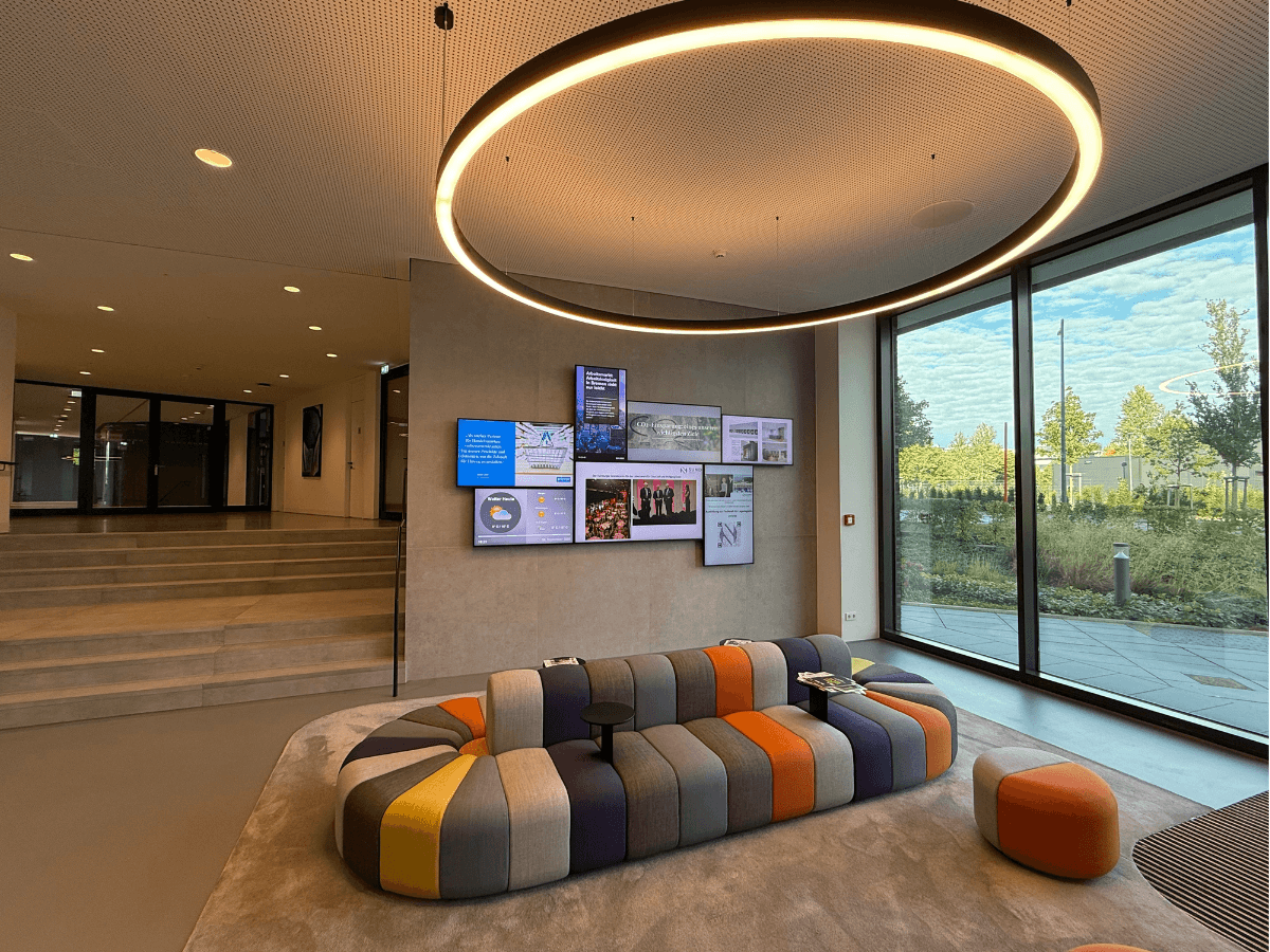 The digital art wall in the SUND Group reception area displays digital signage content for visitors, employees, and modern corporate communications.