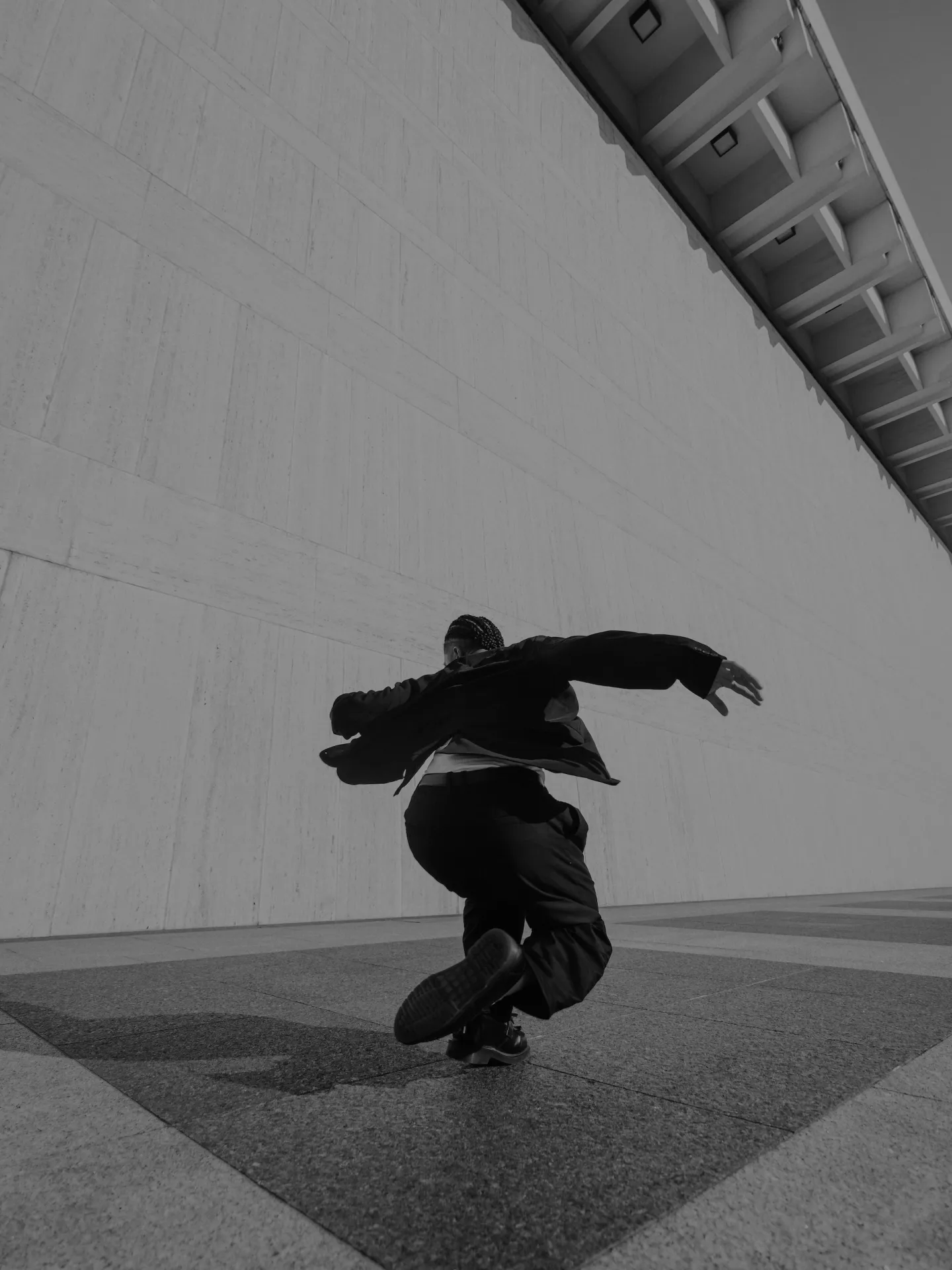 fashionable man dancing black and white photo