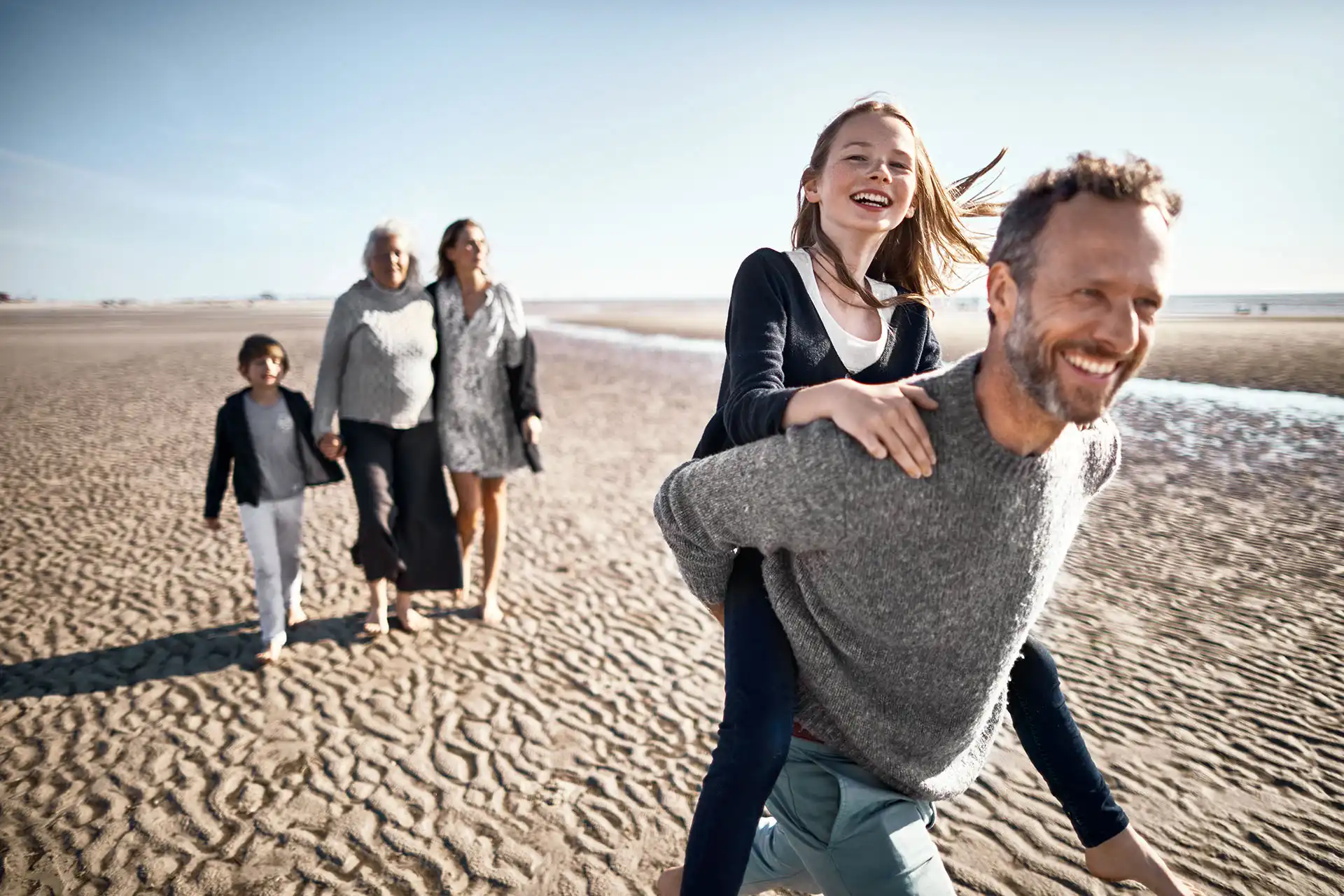 A family with children at the beach.