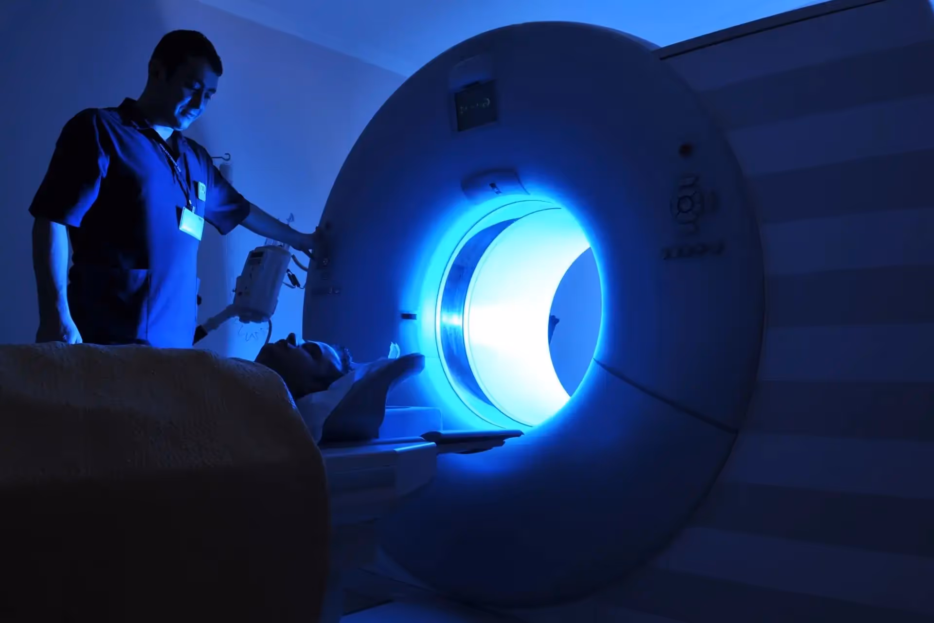 A doctor operating an MRI machine.