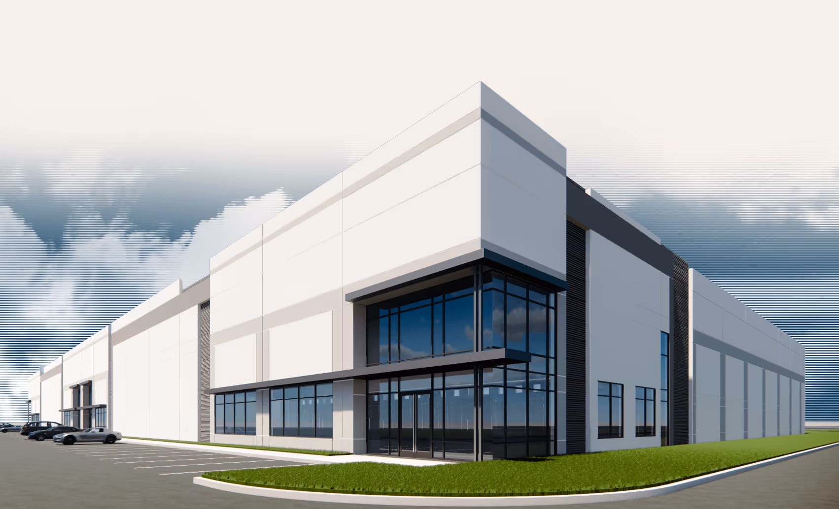 Modern industrial warehouse building with large glass windows and parked cars in front under a partly cloudy sky.