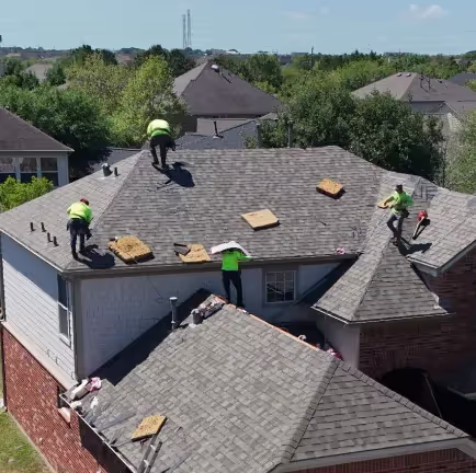 roofers working on top