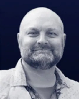 Man with beard smiling warmly, representing Watrfall's creative community