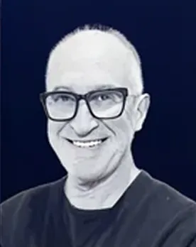 Smiling man with glasses in professional attire