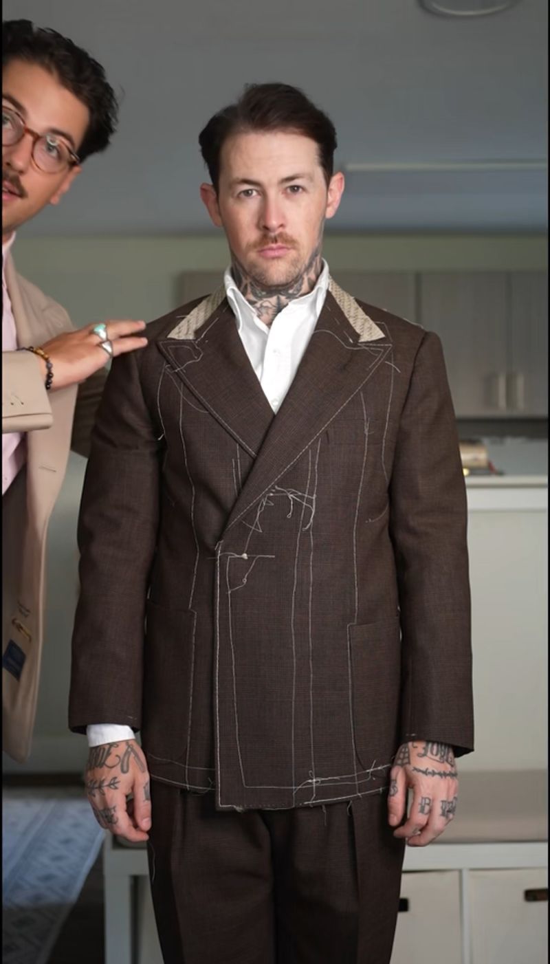 A baste fitting in progress &mdash; the suit shaped on the client before finishing