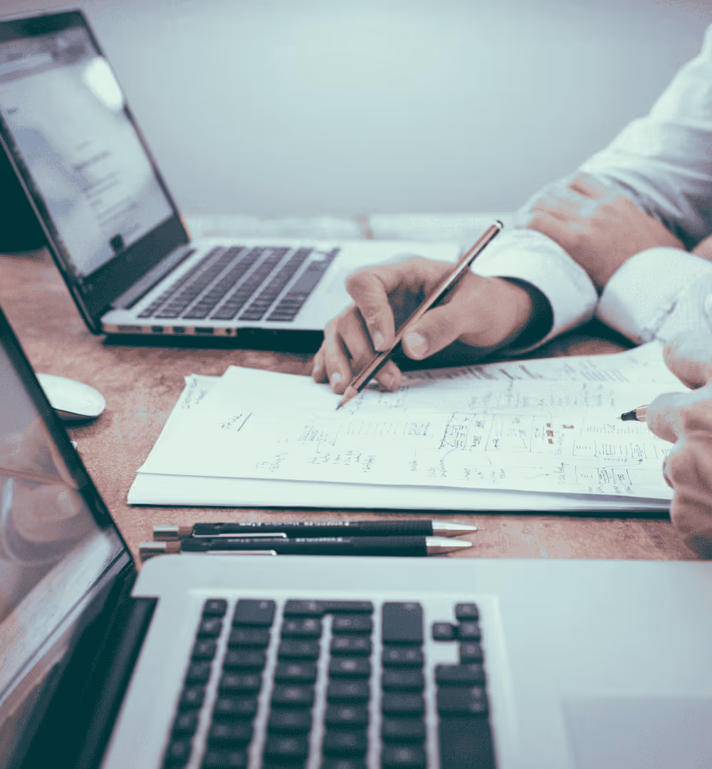 Tax advisor reviewing financial documents and preparing corporate tax filings.