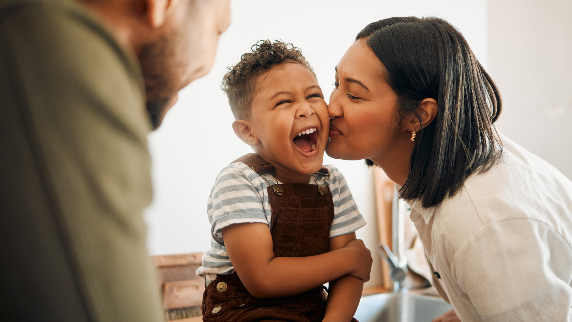 Two business professionals reviewing documents during a meeting in an office.