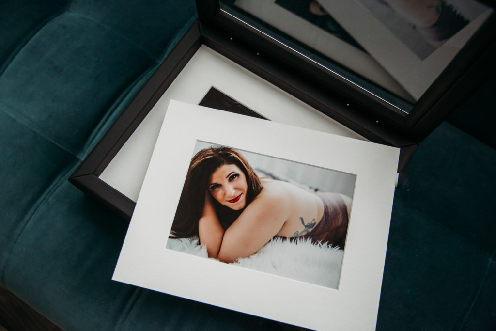 Matted Display Boxes open on teal sofa; photography by Lindsay Hite