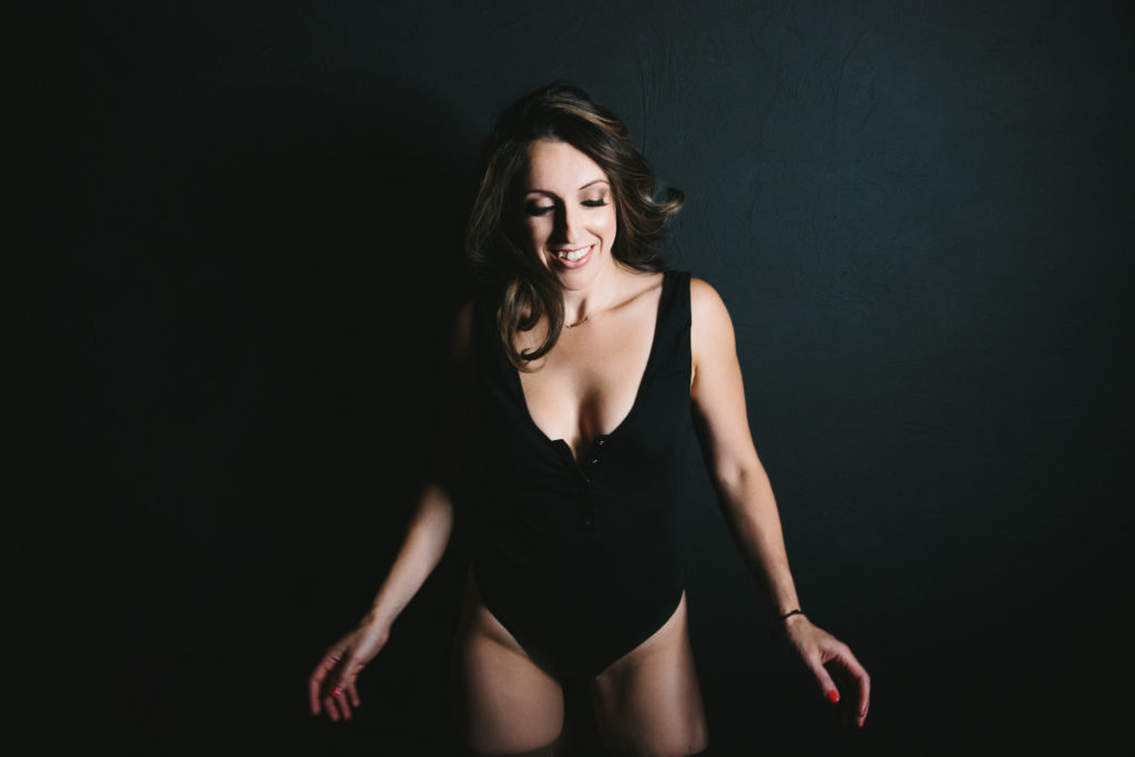 Woman in black bodysuit