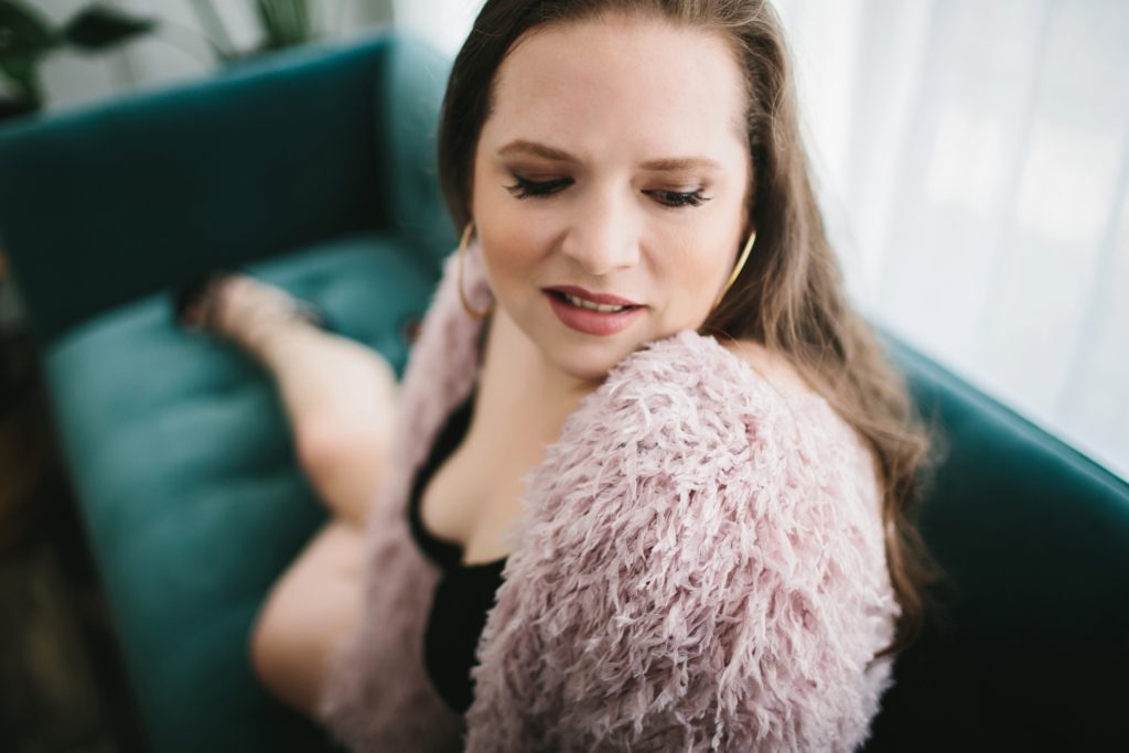 Brunette Woman with Black lingerie and fur shrug, Boudoir Photography by Lindsay Hite
