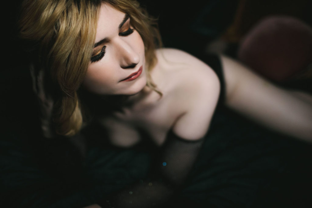 Woman in mesh bodysuit, through the lens of beauty; boudoir photography by Lindsay Hite