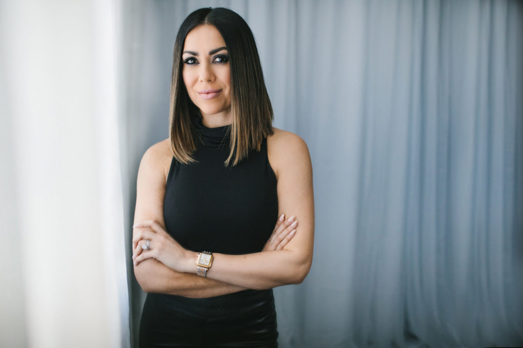 Headshot of woman in black dress and white backdrop, by Lindsay HIte