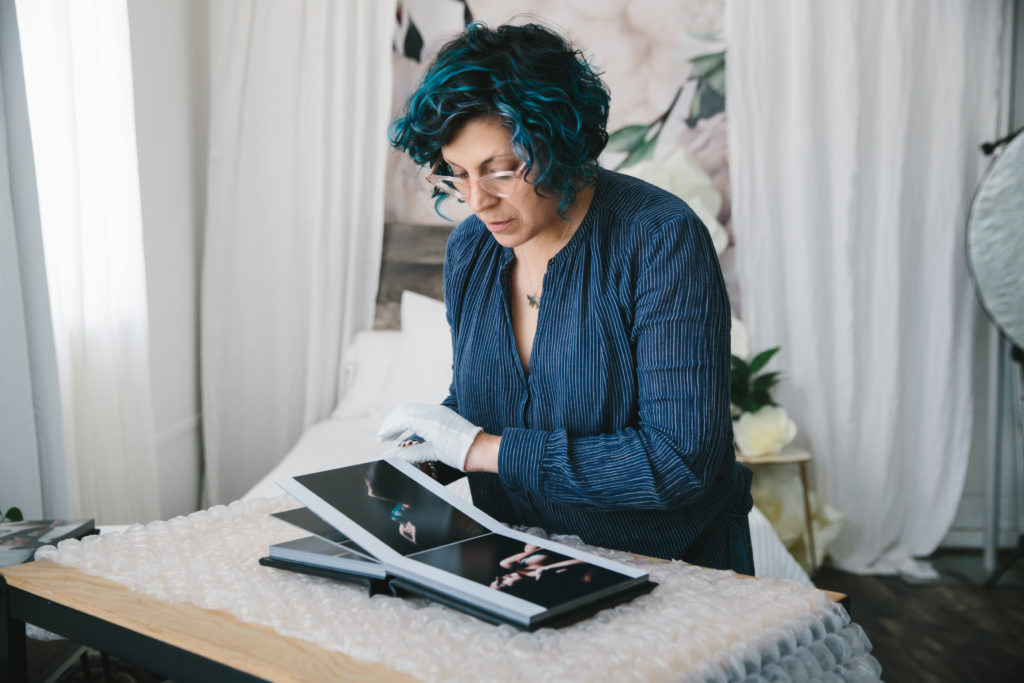 Behind the Scenes look at albums from Show Your Spark Studio; photography by Lindsay Hite