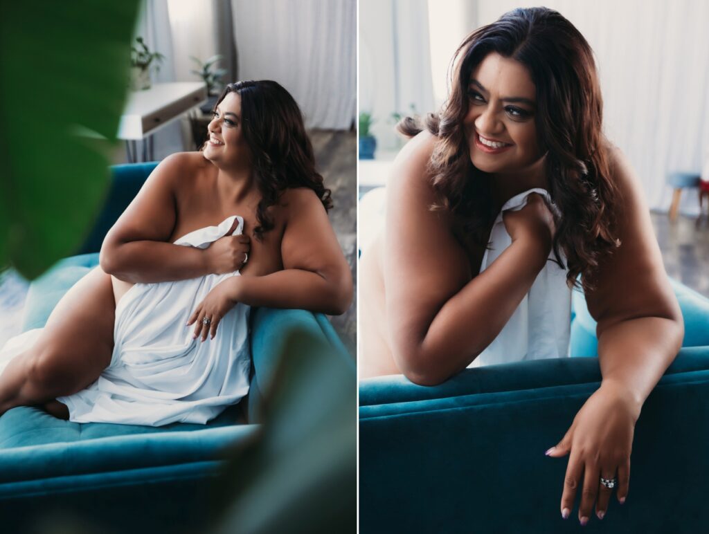 Woman between white sheets on teal sofa, boudoir photography by Lindsay HIte