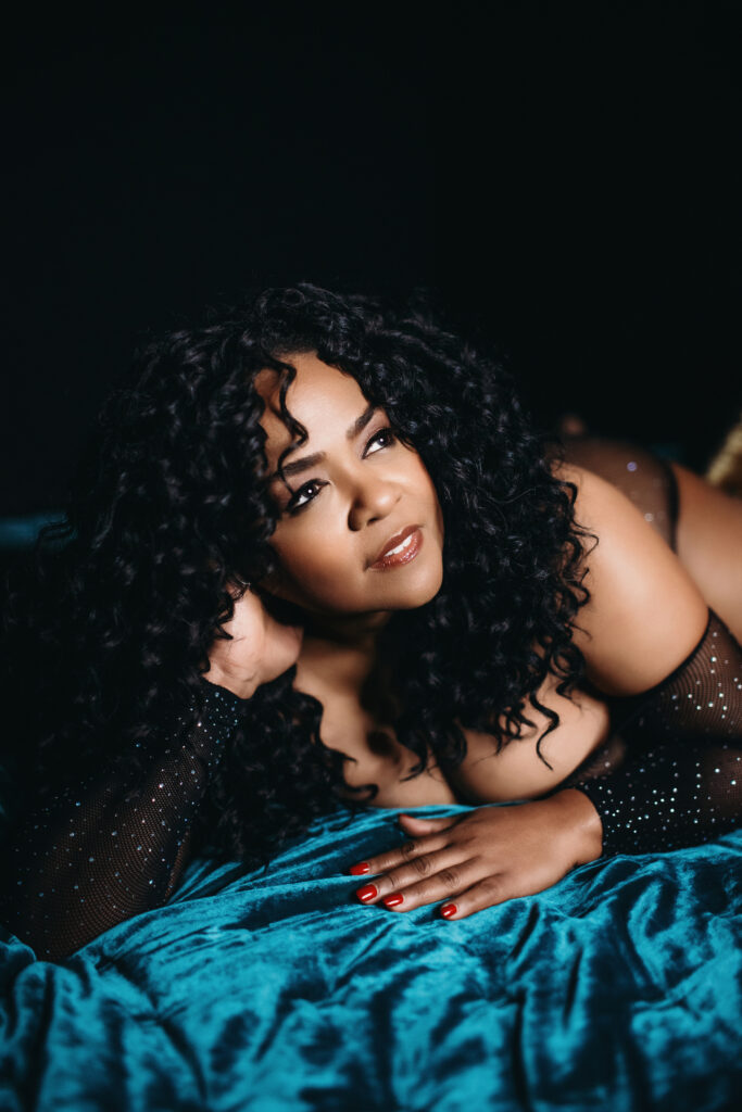 African American woman in black top on her belly looking toward the future knowing it's never too late to start over.  Photography by Lindsay Hite