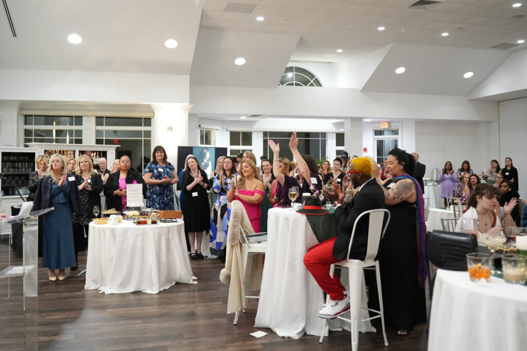 Attendees cheering on the speakers. Photography by Nicole Chan.