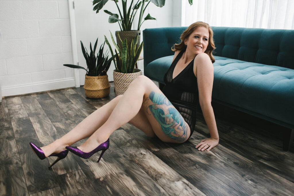Woman in black lingerie and purple heels. Boudoir photography by Lindsay Hite.
