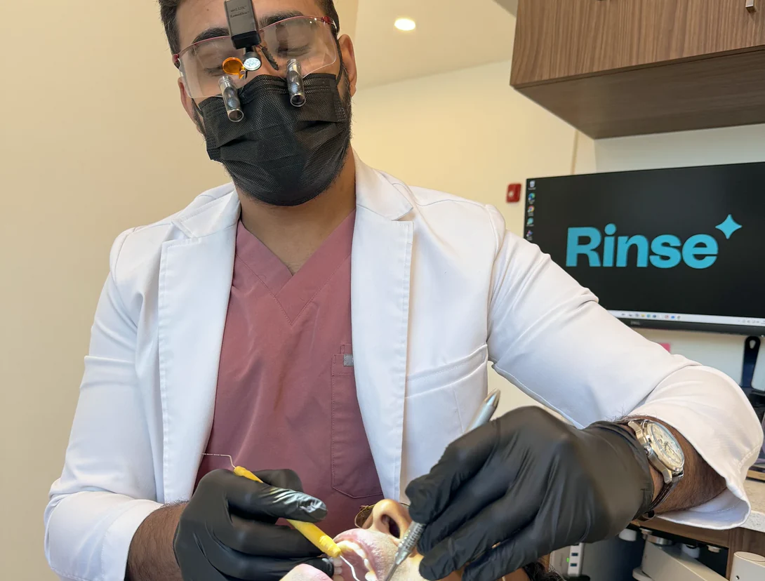 Dr. Sajan Parag providing dental care to a patient