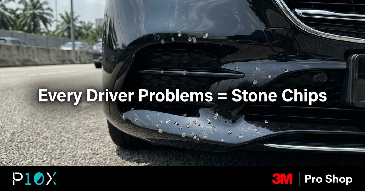 KL highway stone chips on a luxury sedan front bumper on a Klang Valley expressway.