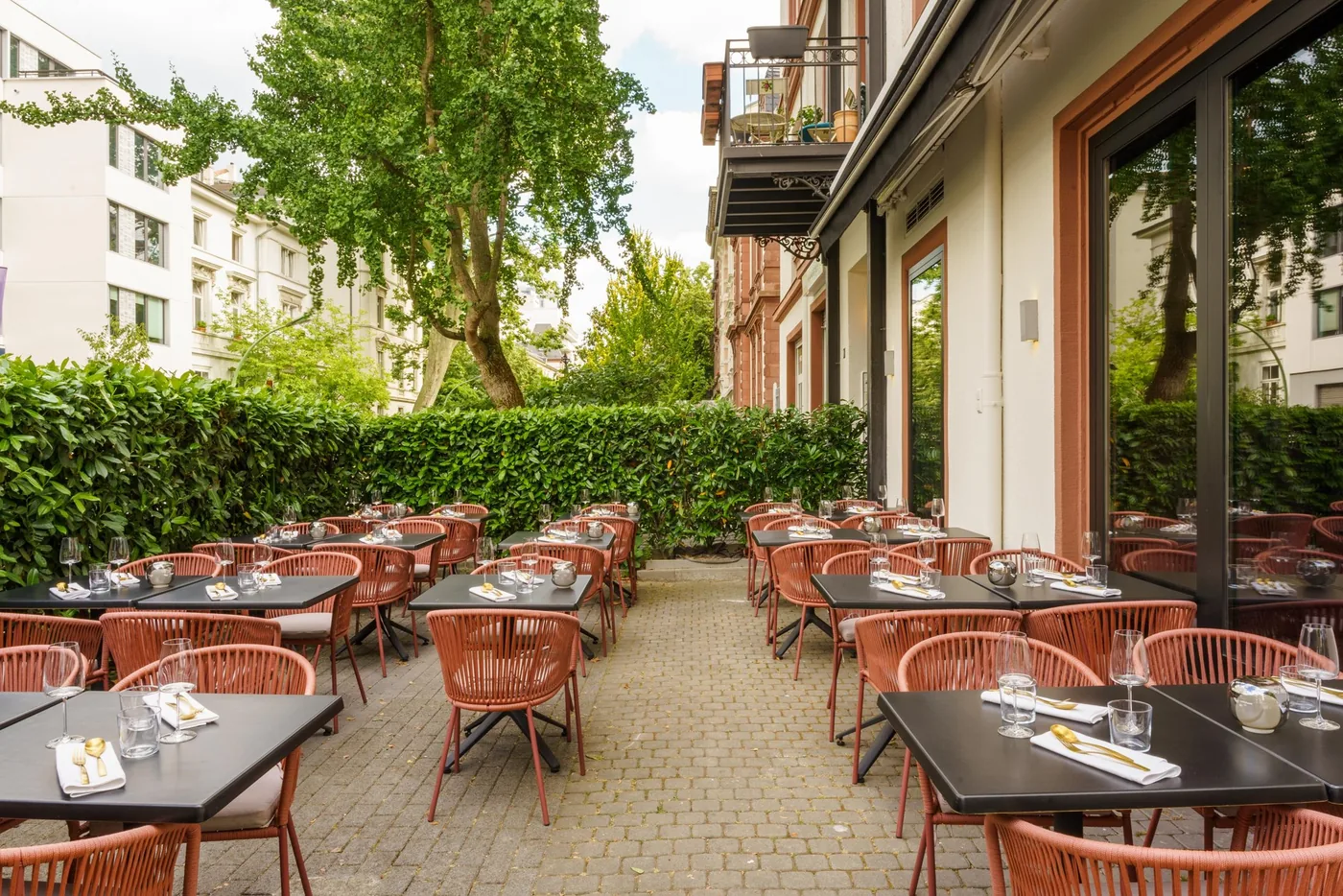 The garden terrace at Umbra, laid for dinner