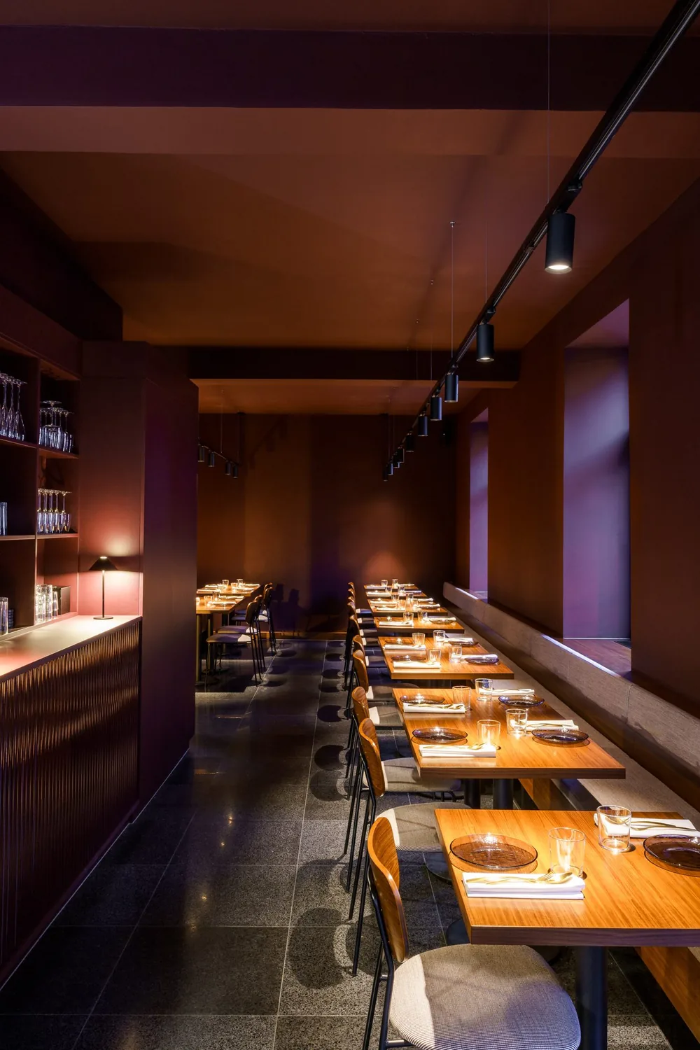 The dining room at Umbra with tables laid for dinner