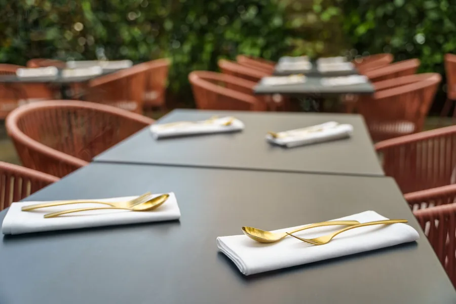 Tables laid on the garden terrace at Umbra