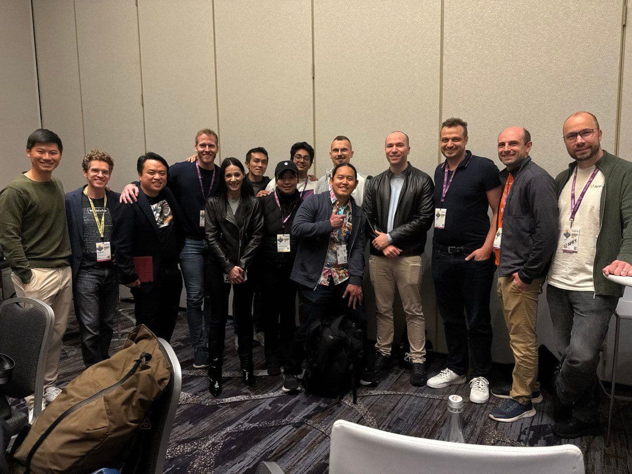 From left: Kevin Hou (Head of Product at Windsurf), Ben Dunphy (conference organizer), Shawn Wang (swyx), Chris Lovejoy (Anterior), Antje Barth, Principal Developer Advocate (Generative AI) at AWS,  Eugene Yan (Principal Applied Scientist at Amazon), unknown, Vibhu Sapra (AI researcher), unknown, unknown, Greg Brockman (OpenAI), unknown, Kyle Corbett (CEO of OpenPipe), Jan Čurn (CEO of Apify)