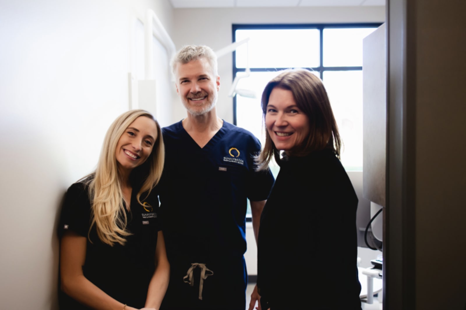 Sunnybrook Dental team members smiling together in office