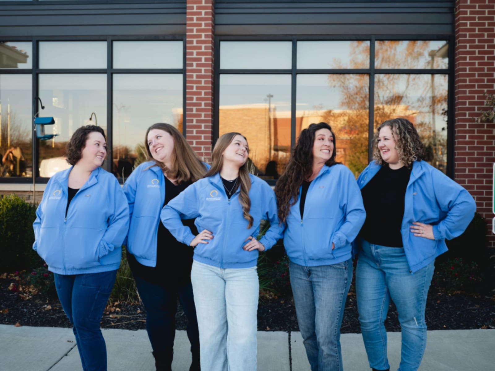 Sunnybrook Dental team members standing together in front of office