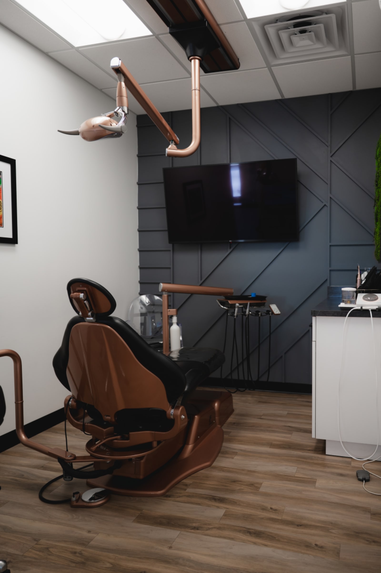 Modern dental operatory chair and equipment in clinical treatment room